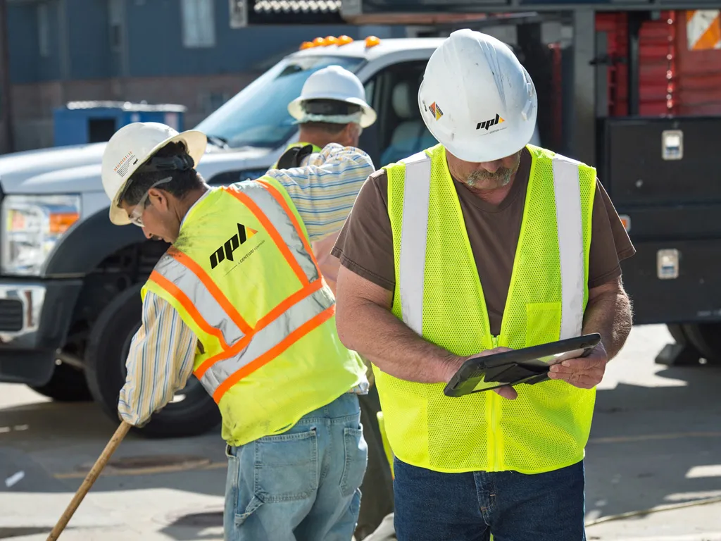 Project Manager on work site with tablet